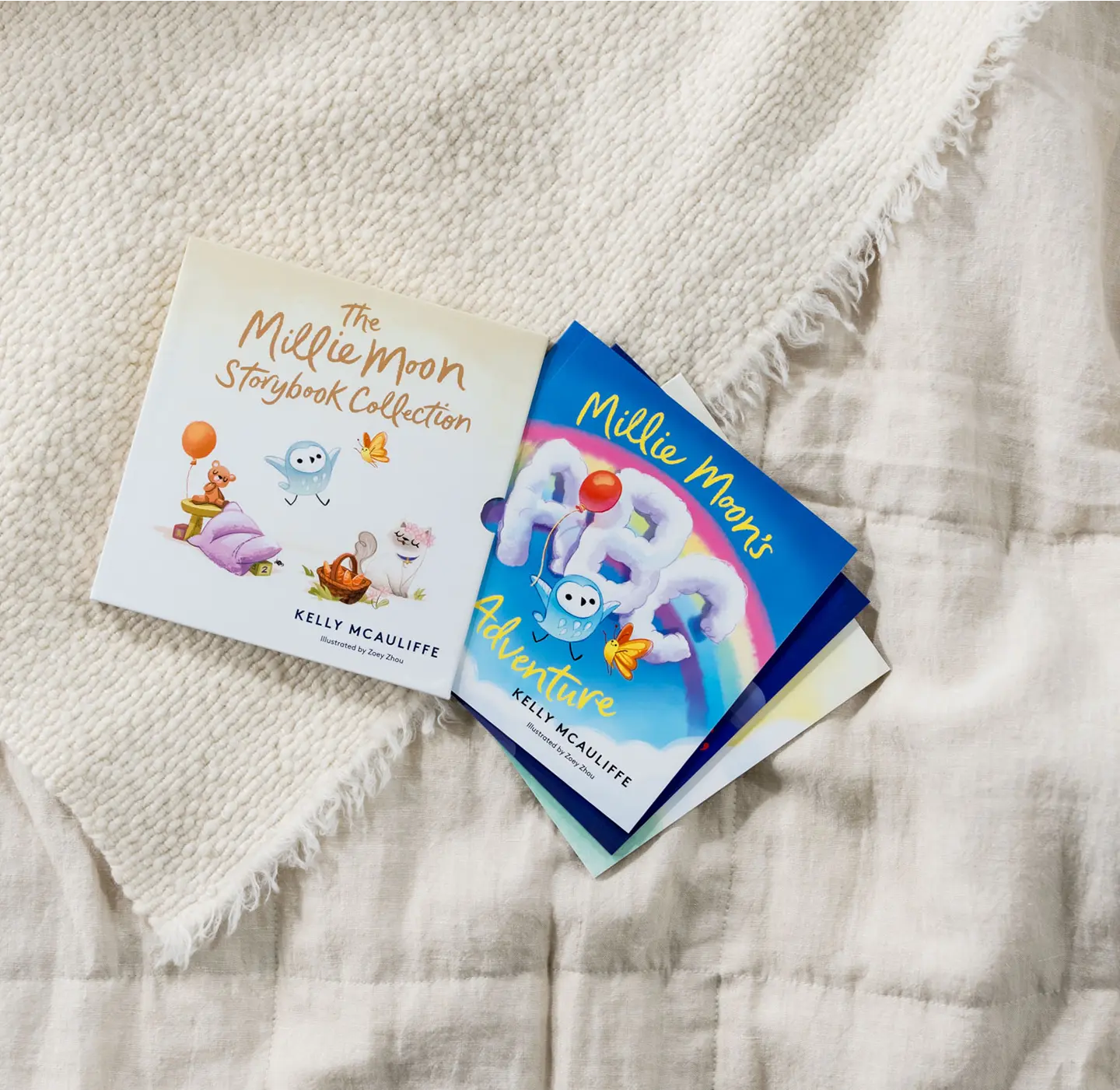 The Millie Moon Storybook Collection and Millie Moon's ABC Adventure books on a linen blanket